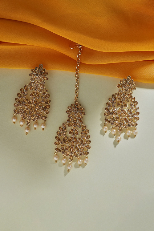 Golden Color Stone Studded Earrings and Tikka with Cream Pearls