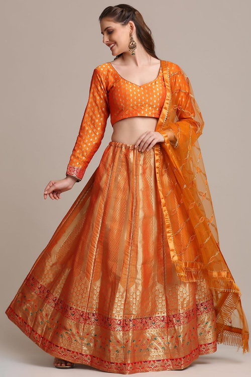 Lehenga for Party Wear in Jacquard Orange with Zari embroidery