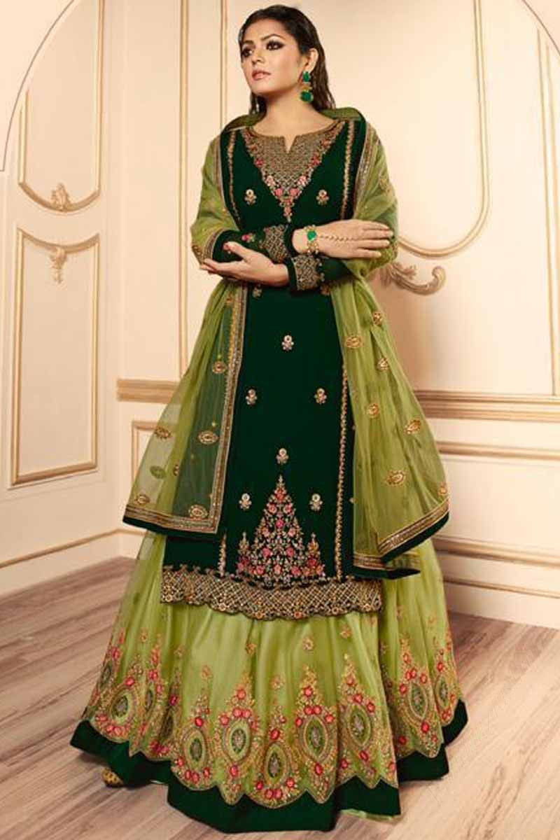 Photo of A bride in green and gold lehenga for her wedding