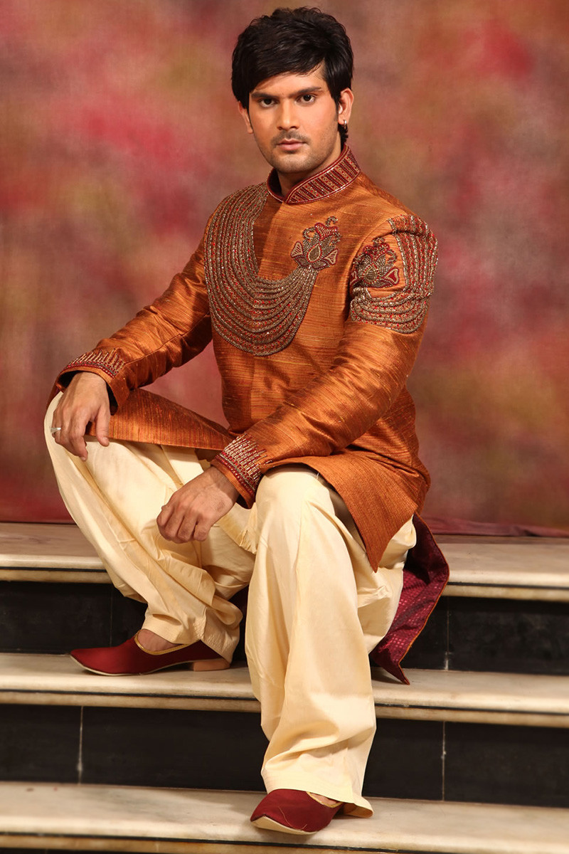 Orange sherwani for groom on sale