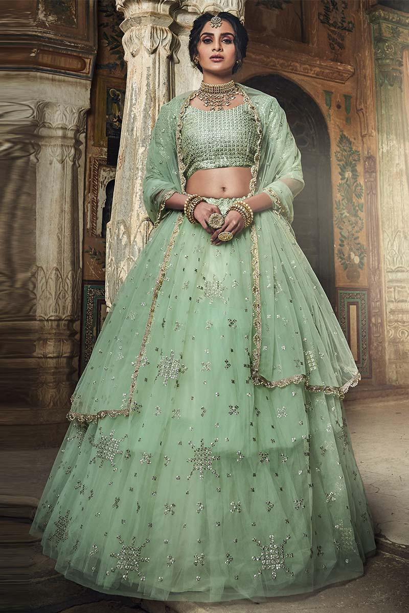 Vibrant Light Green Color Heavy Net Exclusive Wedding Wear Lehenga Choli