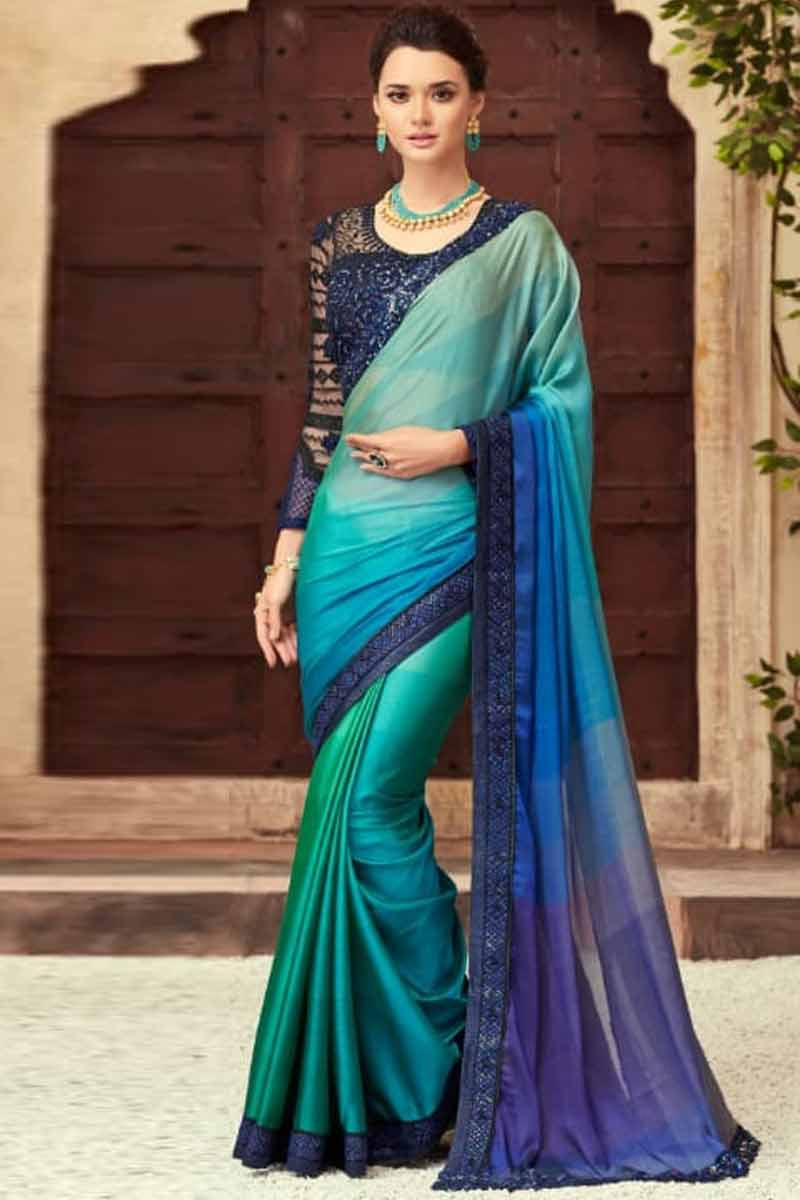 Peacock color Georgette Designer saree elevated with Full- Sequin patterns  all over its body, pallu & border