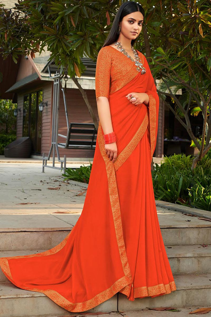 Plain orange saree with designer blouse hotsell