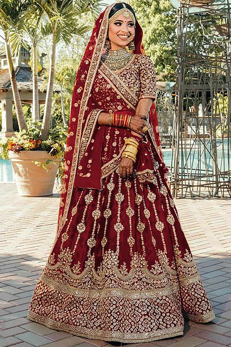 Bridal Lehengas : Maroon velvet heavy embroidered bridal