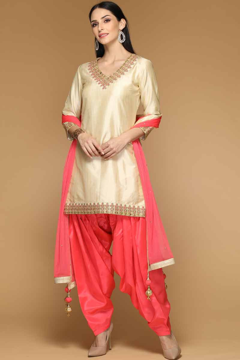 beige suit with red dupatta