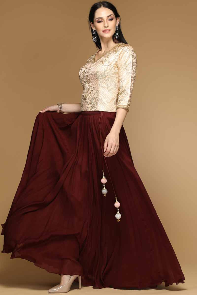 maroon lehenga with golden choli
