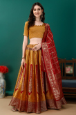 Art Silk Mustard Yellow Woven Zari Panelled Style Lehenga