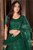 Party Wear Sequins Embroidered Bottle Green Lehenga in Net