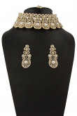 Golden Studded Necklace with Jhumka earrings and Tika.