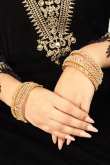 Gold-Pleated Ruby Stone-Studded Traditional Bangles