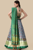 Green Silk Lehenga with Halter Neck Blouse in Resham & Sequins Work