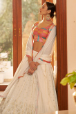 Muqqaiyyash Embroidered Georgette Cream Lehenga