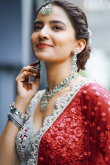 Net Ruby Red Sequins Embroidered Panelled Style Lehenga 