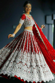 Net Ruby Red Sequins Embroidered Panelled Style Lehenga 