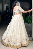 Off White Crushed Organza Lehenga With Zari Work For Festival
