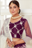 Purple Net Embroidered Wedding Wear Lehenga