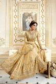 Elegant Net And Silk Anarkali Gown In Peach Yellow Color