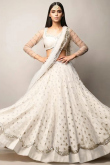 Sequins Embroidered Net Ivory Party Wear Lehenga