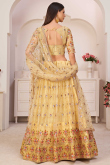 Trombone Yellow Net Embroidered Lehenga