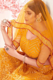 Turmeric Yellow Net Embroidered Party Wear Lehenga