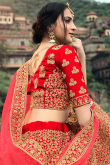 Wedding Wear Paneled Style Embroidered Satin Lehenga In Red