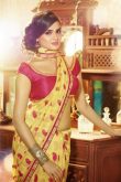 Yellow Georgette Party Wear Saree With Raw Silk Blouse