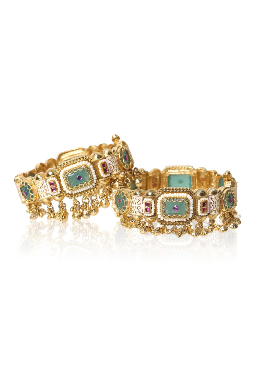 Traditional Festive Bangles Showcasing Detailed Gold Work
