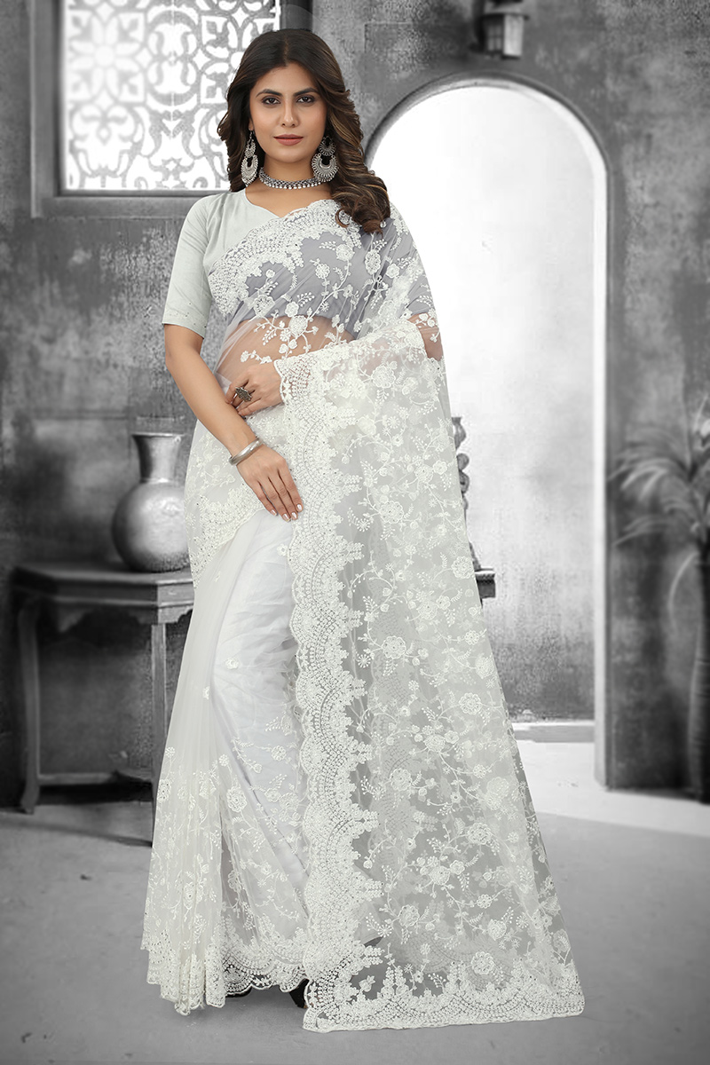 Beautiful moss organza saree with Lucknowi work , white saree , top subtle design for parties and reception