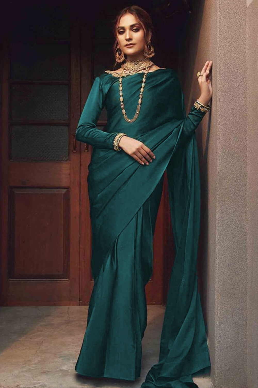 Grab the stylish Plain Pakistani Silk Bottle Green Saree|SARV122900