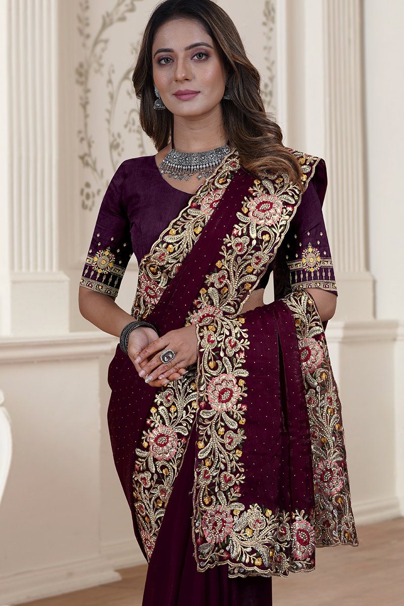 Glamorous and grand wine color premium georgette party saree with heavy orders stone work and mirror work